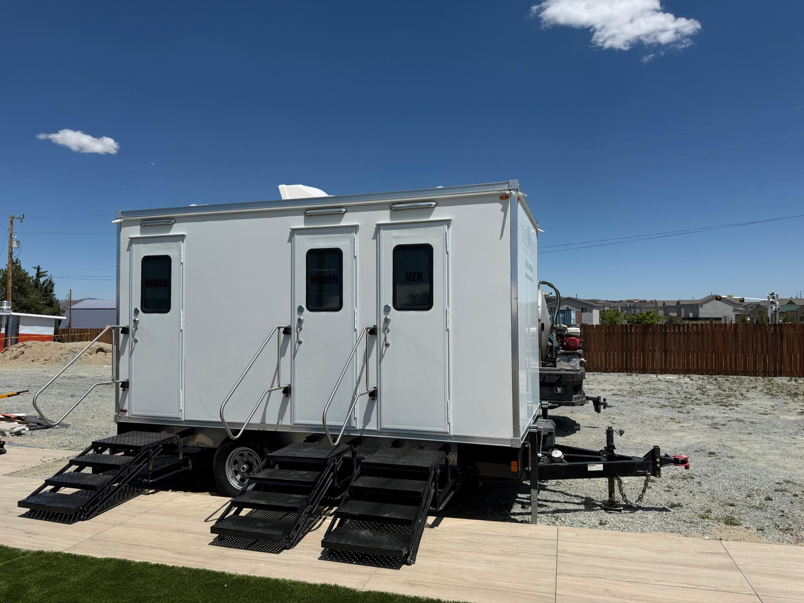 Restroom trailer positioned at an active construction site