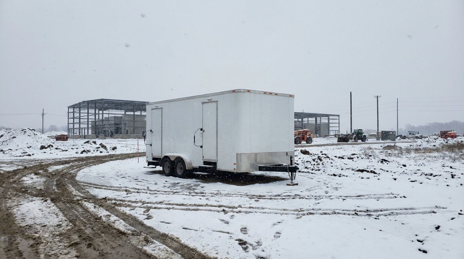 Winterized restroom trailer on a snowy central Ohio site